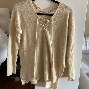 Cream v neck lace up sweater